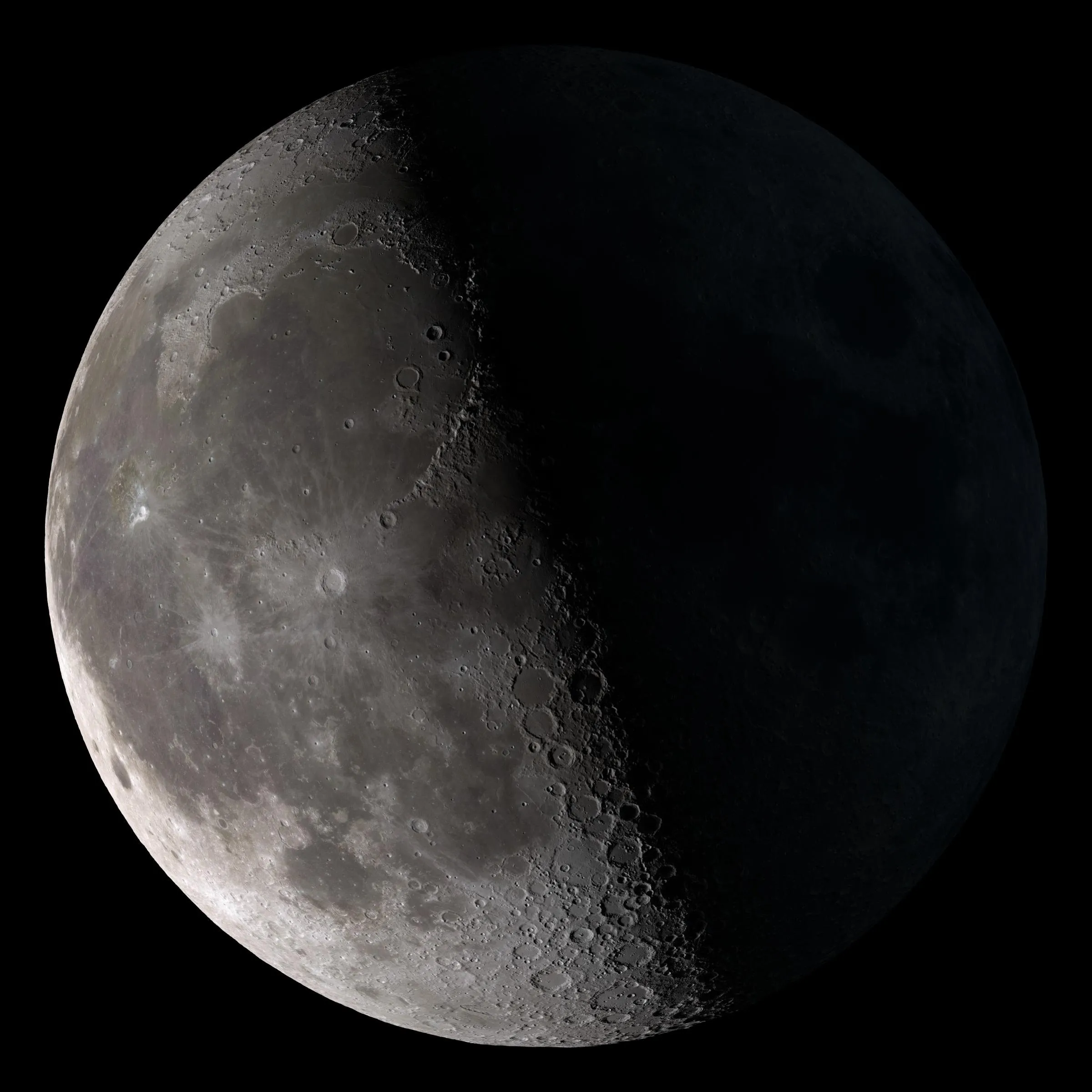 The Moon at first quarter, half in sunlight and half in shadow.