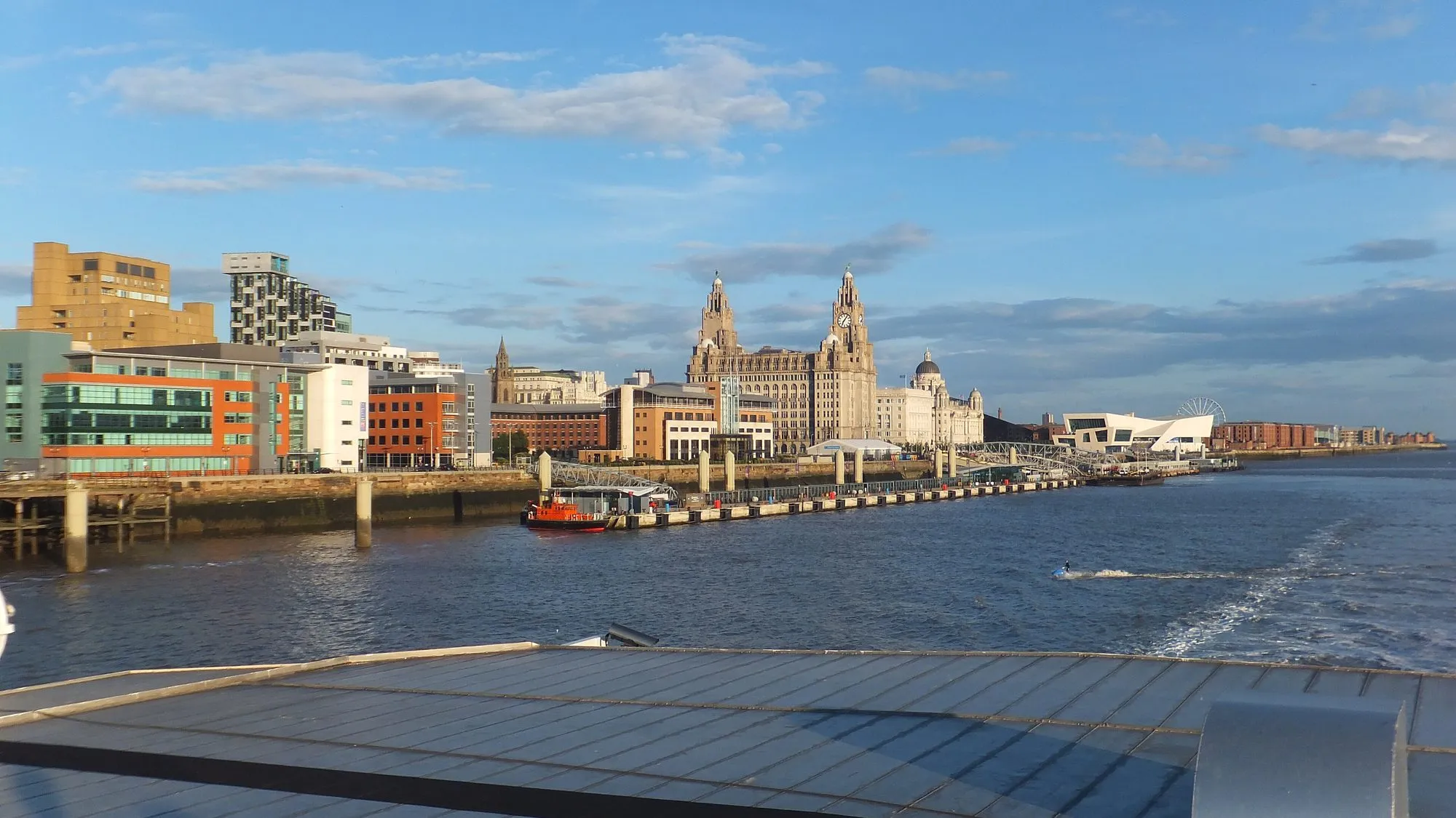 The Liverpool waterfront with the Royal Liver Building, seen from a ferry on the River Mersey.