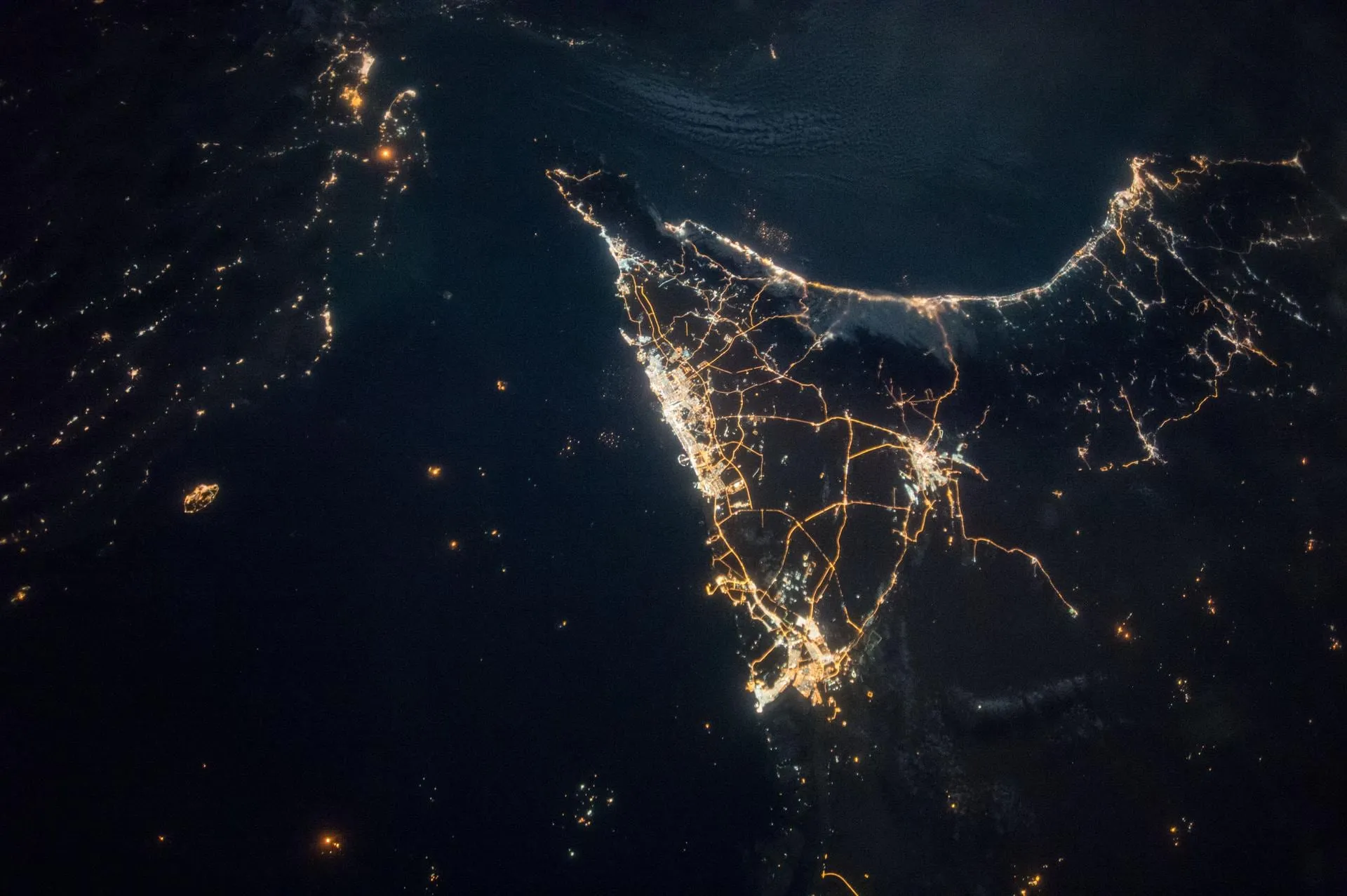 The Nile delta and Cairo glowing at night, seen from the International Space Station.