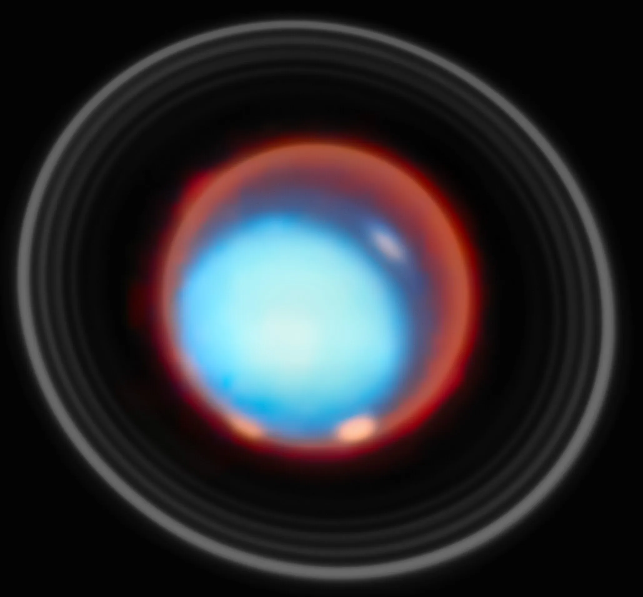 Uranus glowing blue with faint rings and bright poles in infrared.